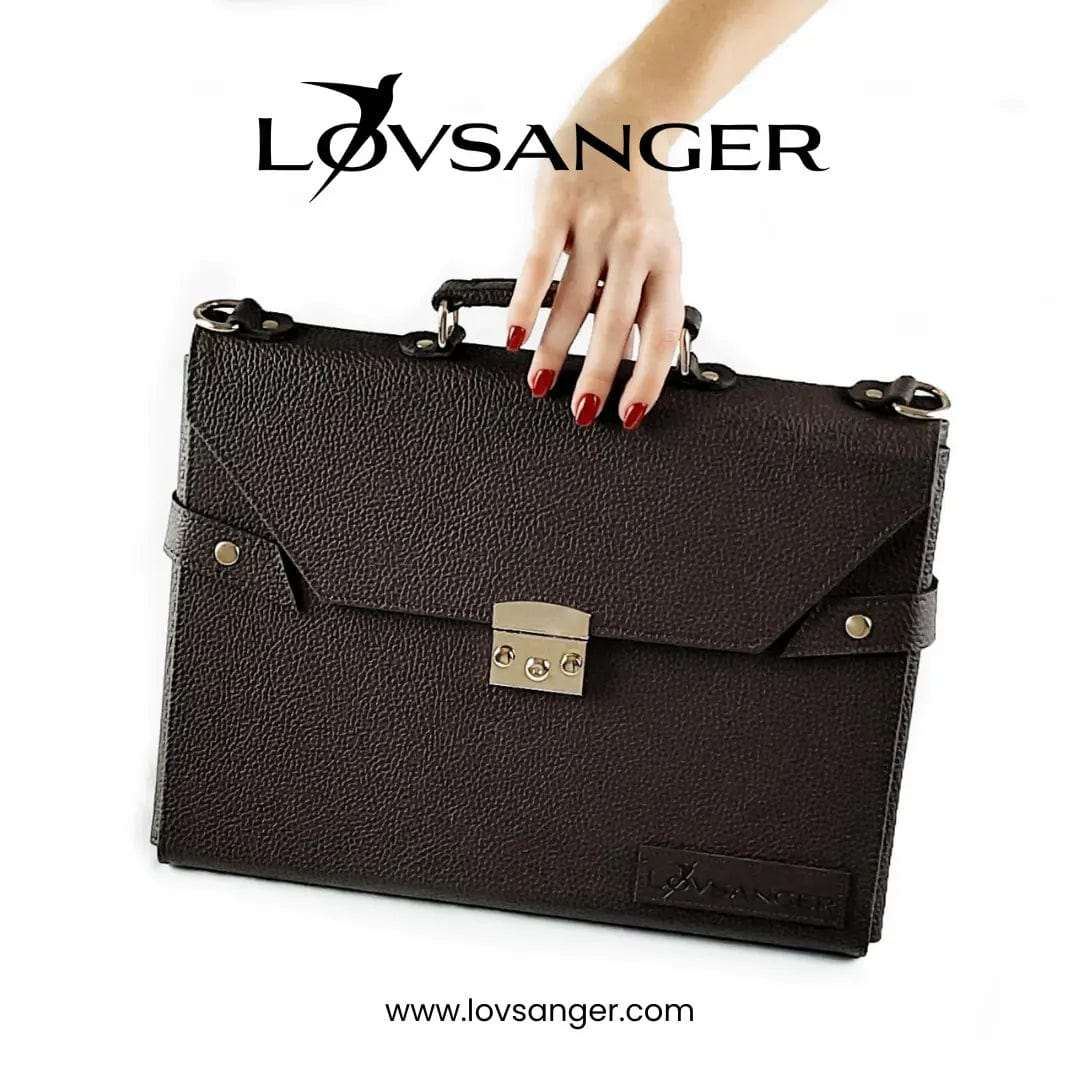 Hand holding the Lovsanger workstation laptop bag